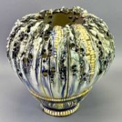 CONTINENTAL CERAMIC ART VASE - in the form of a sea urchin?, having drip ware glazes on a leaf
