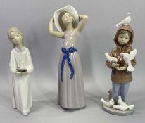 LLADRO PORCELAIN FIGURINES (3) - to include a young boy in duffle coat feeding doves, impressed