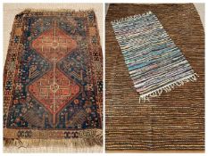 EASTERN RUG with tasselled ends, multiple pattern border and double diamond central motif, 86 x