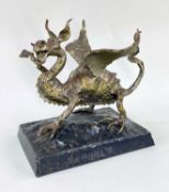 TOM HUGHES patinated metal alloy sculpture - rampant dragon with one leg raised on a steel square