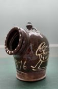 A VICTORIAN DATED ENGLISH SLIPWARE POTTERY SALT 'PIG' deep brown glaze with slip decoration of two