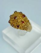YELLOW GOLD GARNET SET TEXTURED RING, ring size R, 7.2gms, in ring box Provenance: private