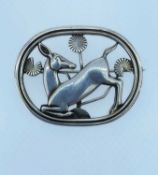 GEORG JENSEN SILVER BROOCH, modelled as kneeling fawn or deer, No 256, designed by Arno