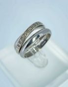 9CT WHITE GOLD DIAMOND CROSS OVER RING, ring size O, together with a platinum wedding band, ring
