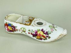 A SPODE PORCELAIN INKWELL IN THE FORM OF A SLIPPER with pointed toe, the cavity divided into two