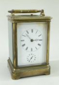 GILT BRASS ALARM CARRIAGE CLOCK, white enamel roman dial, moon hands, alarm sub dial, platform