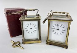 TWO GILT BRASS CARRIAGE CLOCKS, both with white enamel roman dials, one French the other with