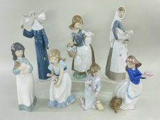 LLADRO / NAO FIGURINES comprising four Lladro figures including a nun, model no. 5551, 26cms high,