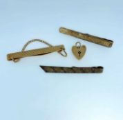 9CT GOLD TIE CLIP, 9ct gold heart shaped padlock (7.5gms overall), together with two silver gilt tie