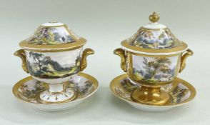 NEAR PAIR OF ENGLISH PORCELAIN TWIN-HANDLED CUPS, COVERS & STANDS early 19th Century, decorated with