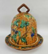 MAJOLICA CHEESE BELL & BASE, modelled as a beehive with fruiting vines, stamped 'MINTON' to the