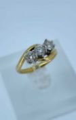 18CT GOLD THREE STONE DIAMOND RING, the three stones measuring 0.8cts overall approx., ring size