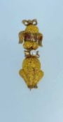 9CT GOLD POODLE BROOCH, having ruby eyes and pearl set bow tie, 4.5gms Provenance: private