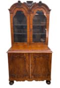 DUTCH WALNUT CABINET, the upper portion with double domed cornice, glazed panel doors, on an