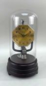 ART DECO BULLE 'JUNIOR' ELECTRIC CLOCK, with electromagnetic pendulum, under glass dome on stepped