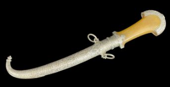 MOROCCAN KOUMMIYA, c. 1900, 9in curving double edged blade with traces of foliate engraving,