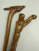 TWO FOLK ART WALKING STICKS, comprising one with twisted snake, heart, anvil, etc carved stem (
