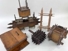 FIVE SPLINTWORK ITEMS, including three money boxes, one of cathedral form, 32cms h, a box rattle,