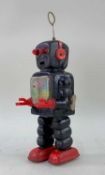 KO YOSHIYA JAPANESE TINPLATE ROBOT, clockwork walking action with transpaent gearing to chest,