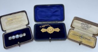 THREE VARIOUS BOXED BAR BROOCHES comprising 9ct gold sapphire and seed pearl brooch in Butt & Co
