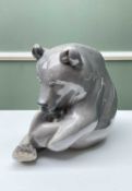 ROYAL COPENHAGEN MODEL OF A BEAR, in seated playful pose, numbered to base '164' & '1233/351',