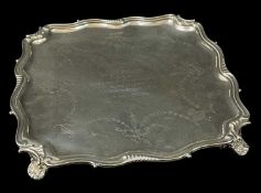 GEORGE V SILVER SALVER, Walker & Hall, Sheffield 1916, shaped square on four shell bracket feet,