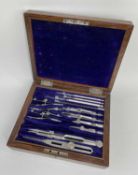 FIGURED WALNUT CASED TECHNICAL WRITING INSTRUMENTS, velvet lined and near complete with Stanley