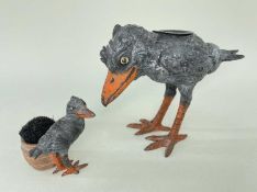 TWO COLD PAINTED METAL WRITING ACCESSORIES, modelled as storks, one a standing inkwell, the other