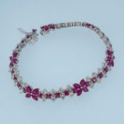 18K WHITE GOLD RUBY & DIAMOND FLOWER BRACELET, 19cms long, 20.9gms, stamped '750', 'D4.30' and '11.