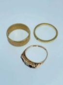 THREE GOLD RINGS comprising 9ct gold wide engraved wedding band, 9ct gold ring set with semi-