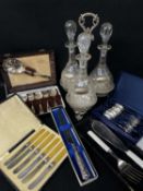 ELECTROPLATED TRIPLE DECANTER STAND, with 3 cut glass decanters with lables, 35cms high, together