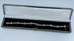 9K GOLD DIAMOND RUB-OVER BRACELET, of alternating bar and collet design, 20cms long, 13.8gms, in