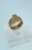 YELLOW METAL RING designed as a rectangular gold bar supported by five rings, ring size N 1/2, 6.