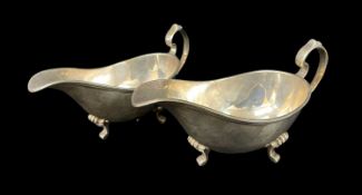 PAIR SILVER SAUCE BOATS, Sheffield 1975, of heavy gauge, with reeded edge on three shell scrolled