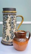 LARGE DOULTON LAMBETH STONEWARE JUG BY GEORGE TINWORTH, decorated with flowerheads and oak leaves,