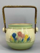 CLARICE CLIFF NEWPORT POTTERY 'CROCUS' PATTERN SWING HANDLE BISCUIT BARREL (no lid) - 12.5cms tall