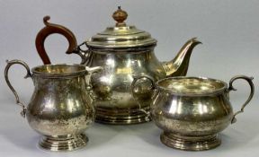 GEORGE V THREE PIECE SILVER TEA SERVICE of plain circular form, Birmingham 1929, maker Adie Brothers