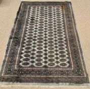 EASTERN STYLE WOOLLEN RUG - ground green with multiple borders and multiple diamond and circular