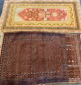 RUGS (2) - gold ground with red floral central pattern, 145 x 70cms and red prayer rug with zig