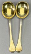 SHEFFIELD 1903 SILVER SERVING SPOONS, A PAIR - Maker George Guirren Rhoden, having shaped handle