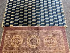 RUGS (2) - blue and cream ground with block pattern, 134 x 69cms and pink with three central
