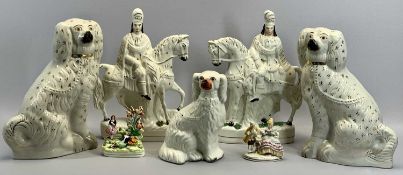 VICTORIAN STAFFORDSHIRE FIGURES - seated spaniels, a pair, cream glazed with black mussels, gilded