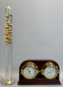 SEWILLS NAUTICAL DESK STAND, a mahogany case set with a brass cased bulkhead type clock and