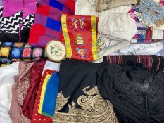 A HANDMADE WOOLLEN PATCHWORK BED COVER - approximately 220 x 180cms, an Indian hand embroidered