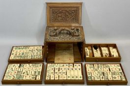 CHINESE MAH-JONG SET - in carved hardwood case, sliding door enclosing five drawers, 20cms H,