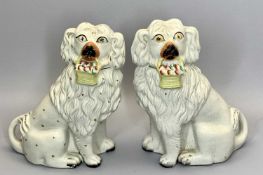 VICTORIAN STAFFORDSHIRE FIGURES OF SEATED SPANIELS, A PAIR - each well modelled with open front legs