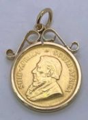 1980 GOLD 1/10TH KRUGERAND - in a 9ct mount and hook, 4.2grms