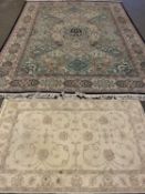 RUGS (2) to include a fine large multi-pattern border and coloured rug with central diamond and