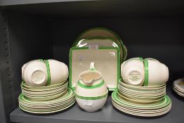 A part tea service in an art deco green colourway