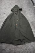 A vintage coney wrap and a green wool cape.